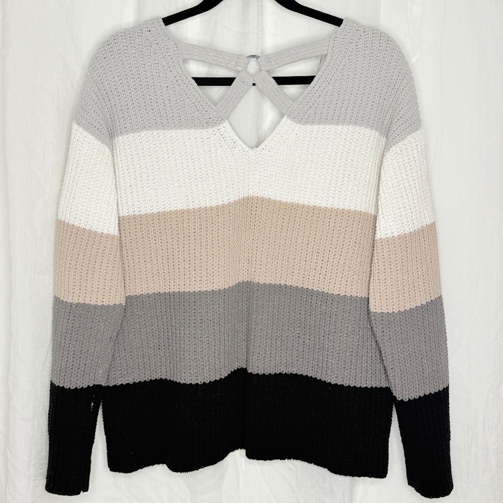 V neck with crisscross detail in back.